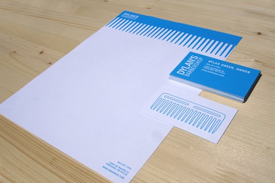 Dylan's Barbershop hass a blue comb graphic as a letterhead