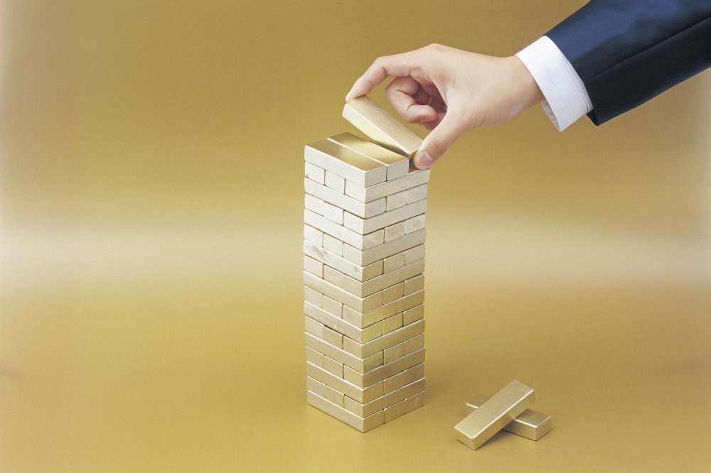 Stack of gold Jenga blocks