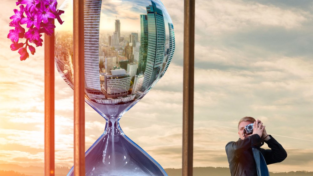 an hourglass with a skyscraper scene in it