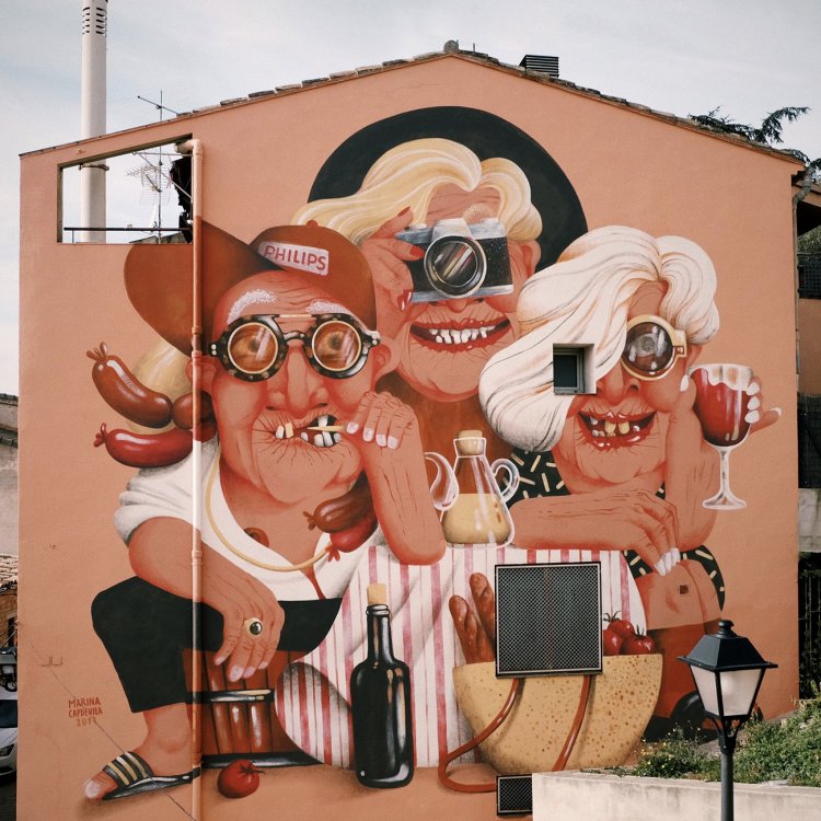 Three cartoon figures painted on a two-storey house