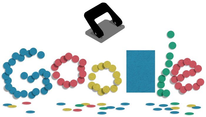 A hole punch and a Google doodle made up of colourful circular paper cutting