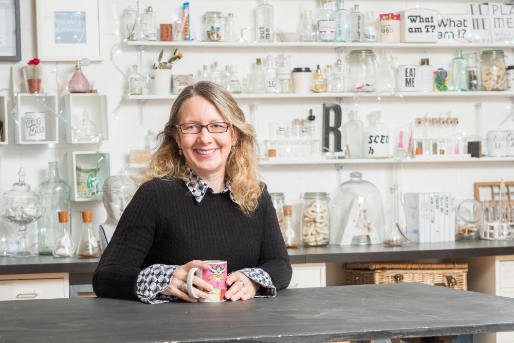 Sarah Hyndman sitting at a desk