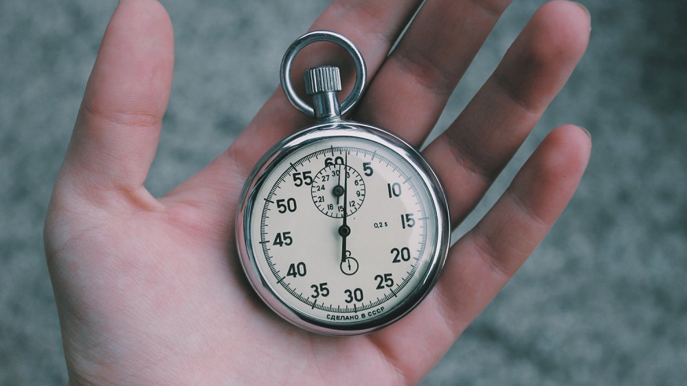 Stop watch in a hand