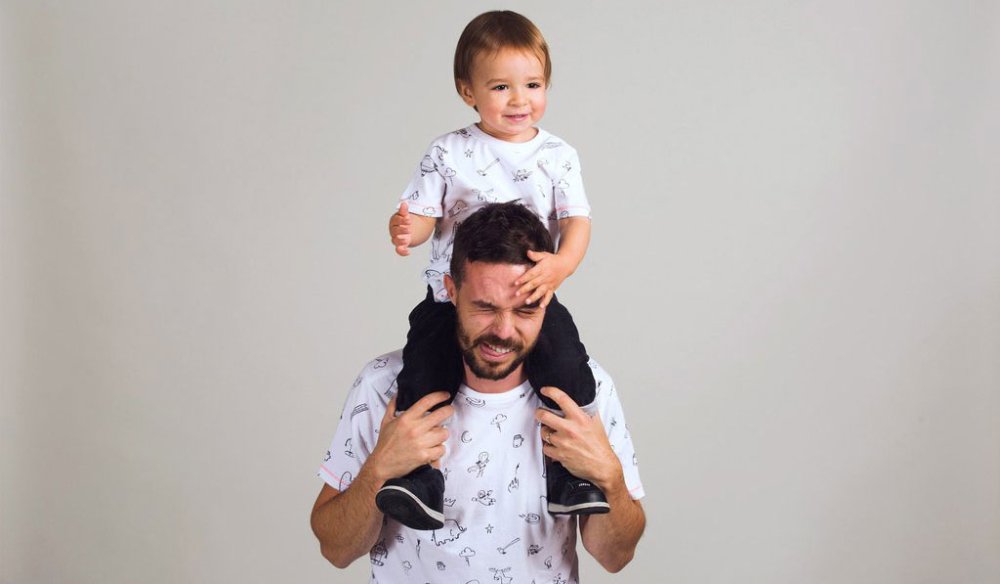 Man and child wearing T-shirts featuring Oliver Jeffers illustrations