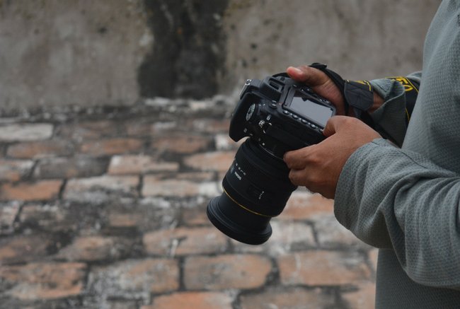 Man checking a DSLR screen