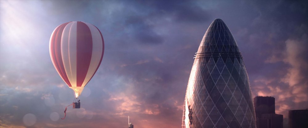 A hot air balloon flies over the gherkin in London's financial district