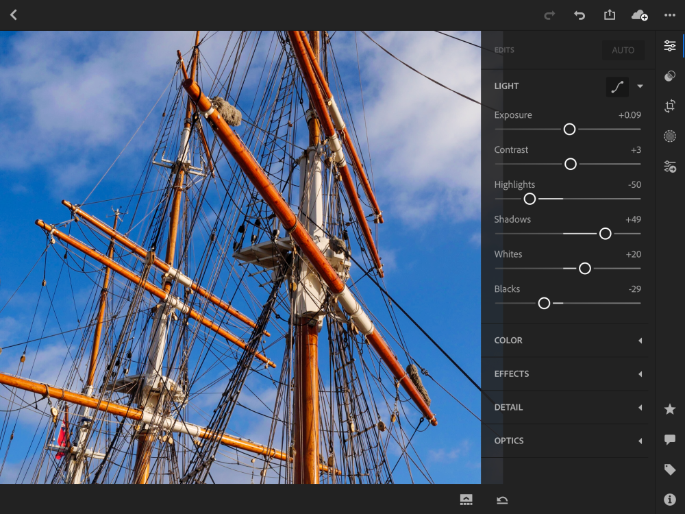 Photograph of boat masts being edited in Lightroom