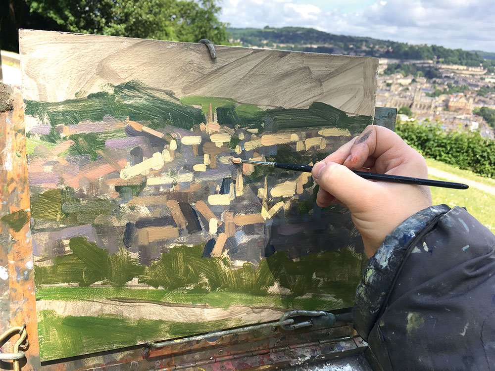 Artist applies finer brushstrokes and building shapes become more recognisable