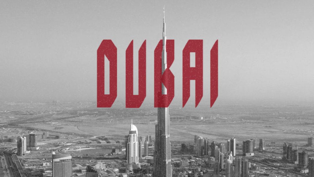 Dubai font appears in red over a black and white photo of the cityscape