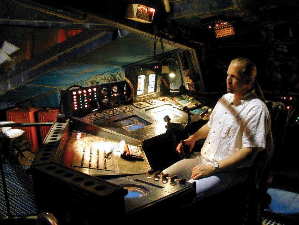 Lee Stringer sits in space ship's control bridge