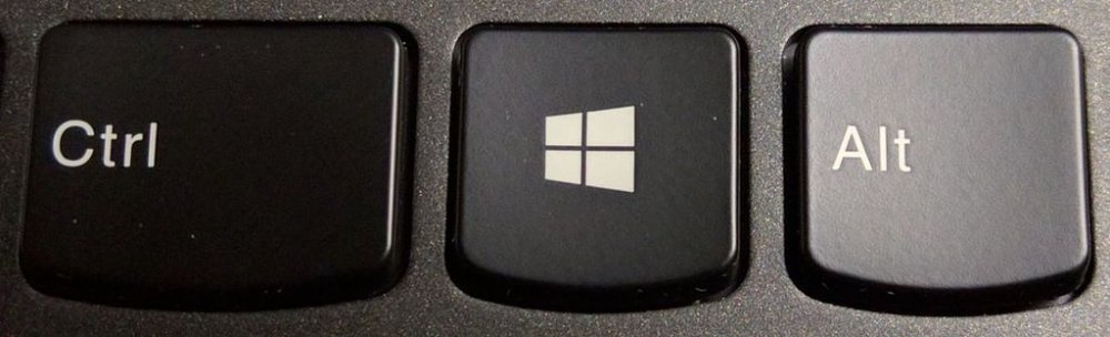 The Windows key on a PC keyboard, in between the Ctrl and Alt keys