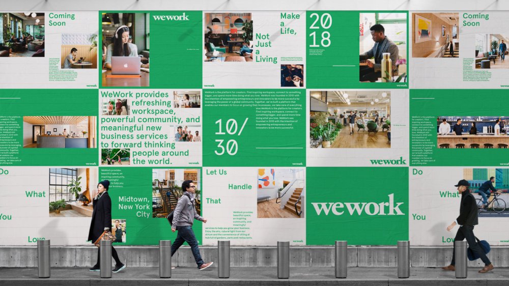 People walking by billboard for WeWork