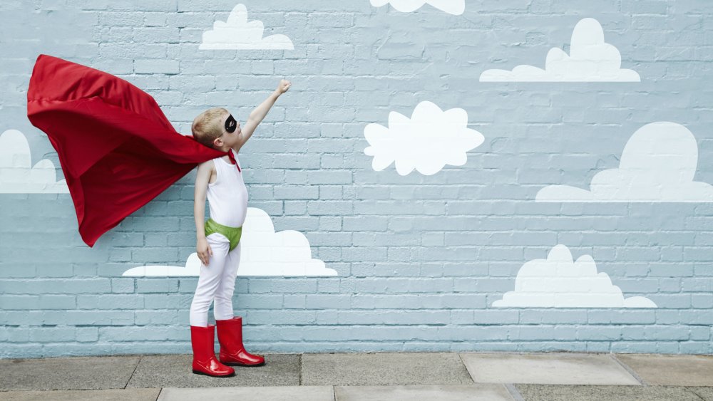 small boy dressed as a superhero