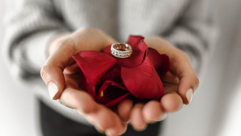 Ring presented on rose petals