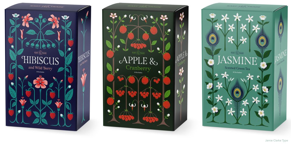 Three tea boxes adorned with geometric flower patterns