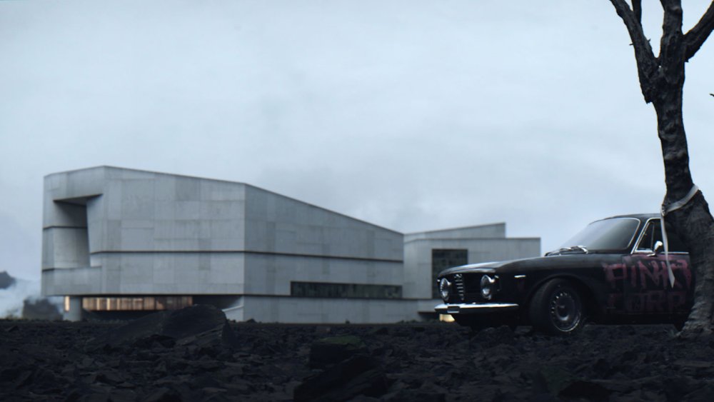 Concrete building exterior behind a car and tree