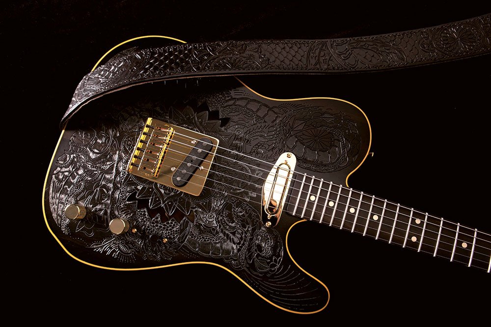 Guitar art inspired by tattoos by Ollie Munden