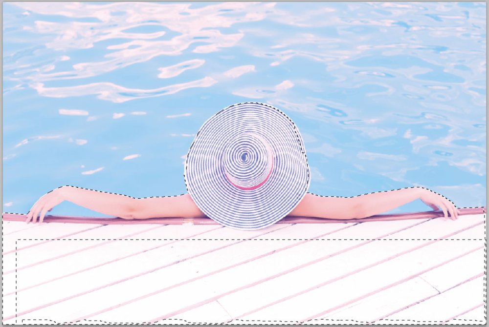 person with hat by pool in Photoshop with part of image selected