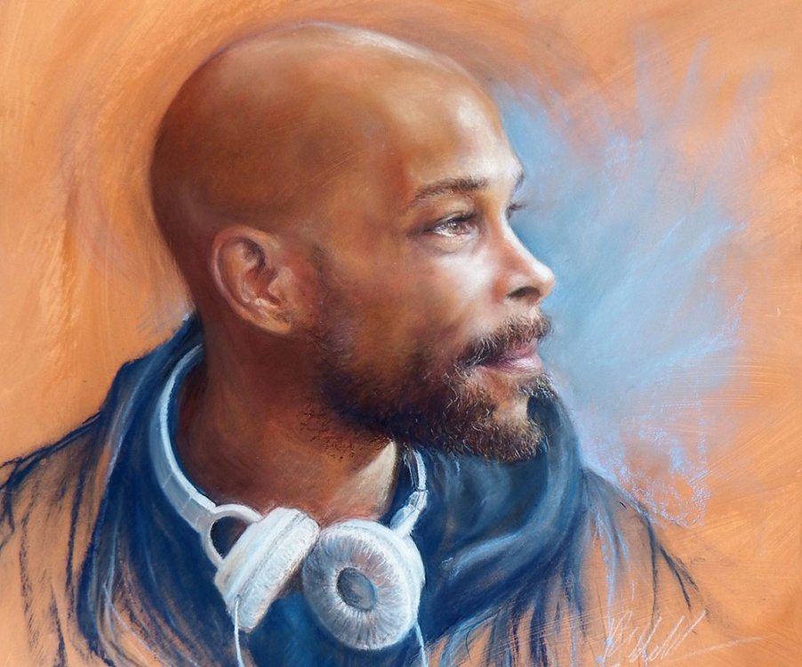 Pastel portrait of a man with headphones around his neck