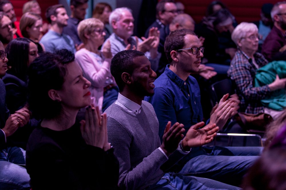 people at conference clapping