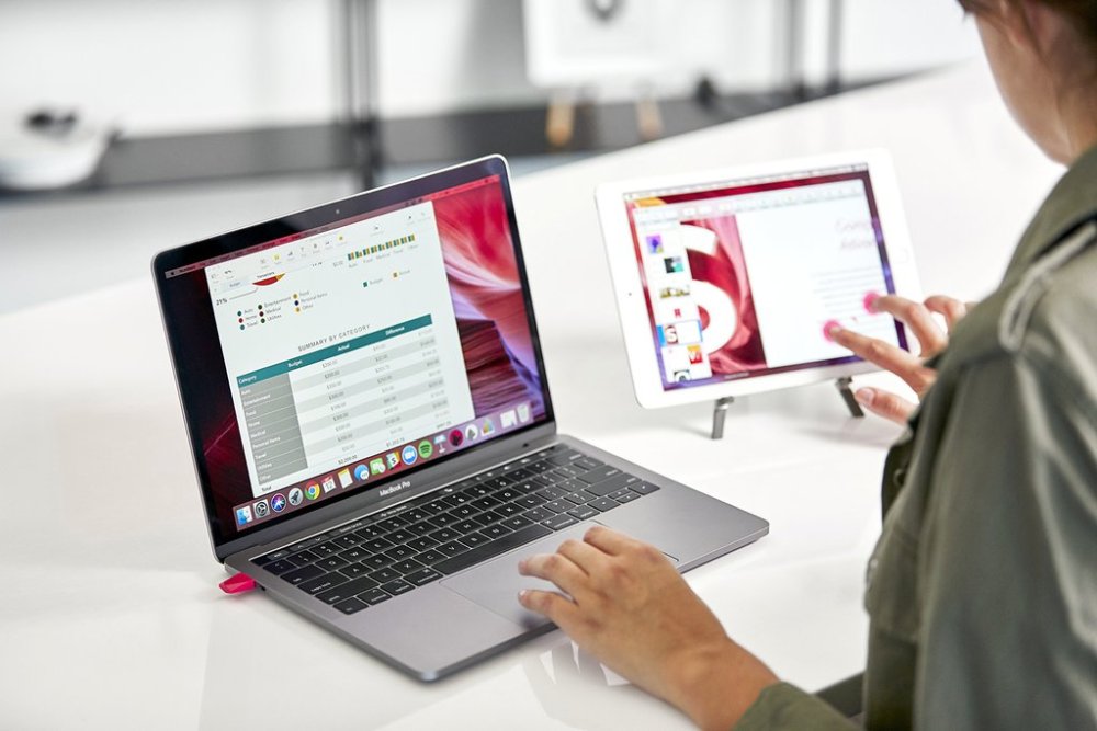 Woman using iPad as second monitor