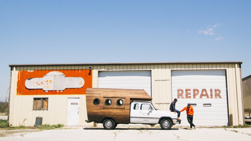 Van in front of a garage