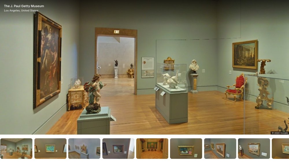 Various art exhibits in a museum room
