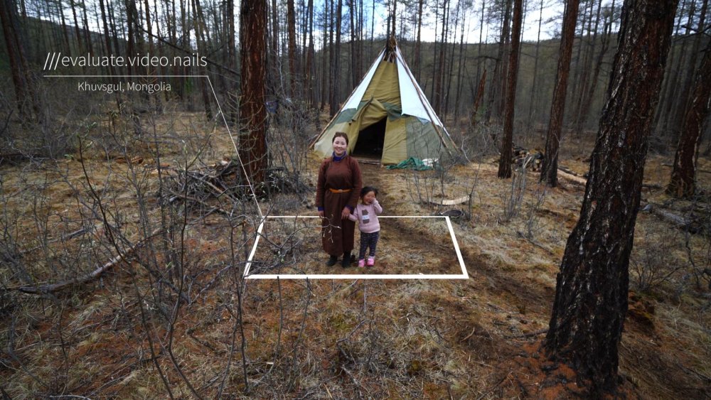 Mongolian mother and child in front of tent