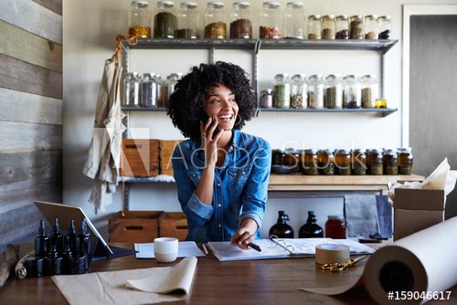 Businesswoman on the phone in her skincare studio