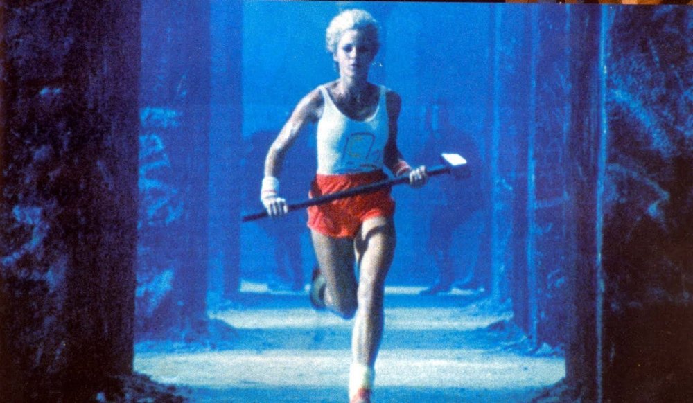 A female athlete runs with a hammer