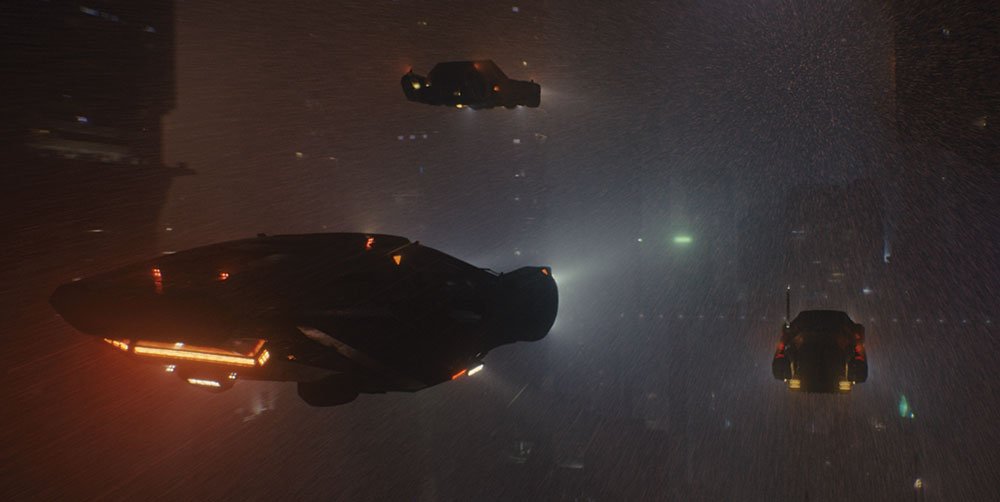 Spinner driving through a city in Blade Runner 2049