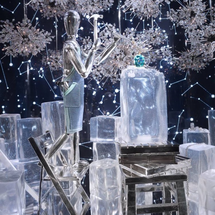 A large metallic artists' mannequin sculpting from ice in Tiffany & Co's Christmas 2017 window display