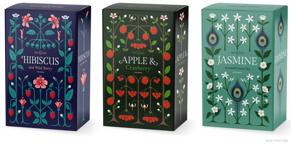 Three tea boxes adorned with geometric flower patterns