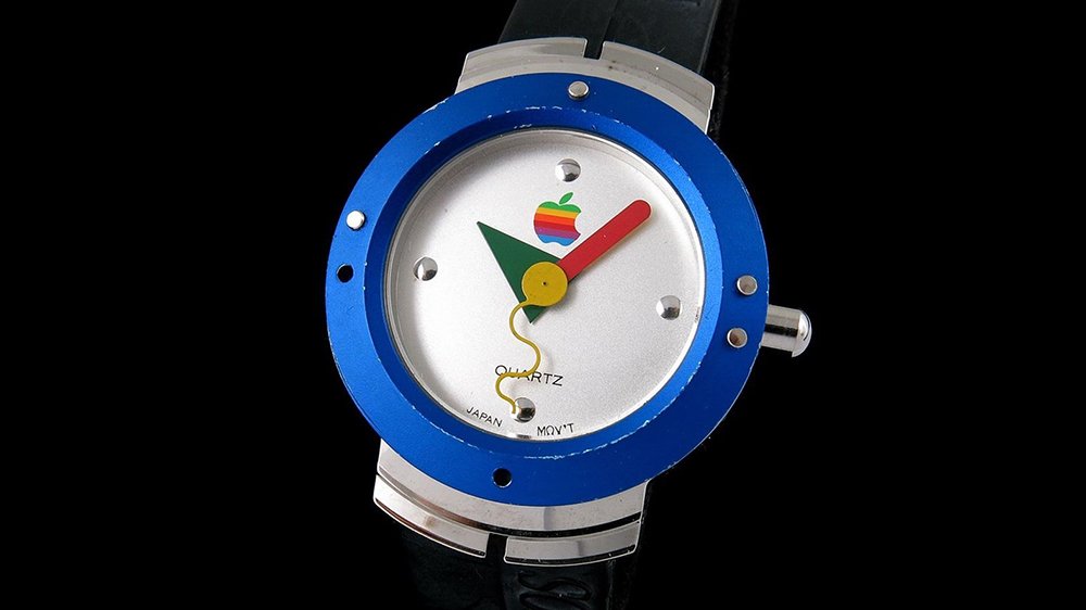 Analogue watch with rainbow Apple logo and electric blue rim
