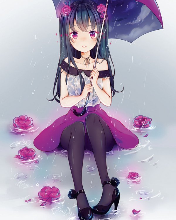 A girl sitting in a puddle holding an umbrella